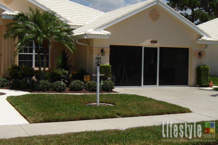 Lifestyle garage screen with white frame on a double garage door opening